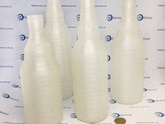 3DDevice printed bottles on a 3D printer. FDM technology, prototyping containers, custom models.