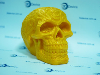 Decorative 3D printed skull model on printer platform. 3DDevice FDM printing service.