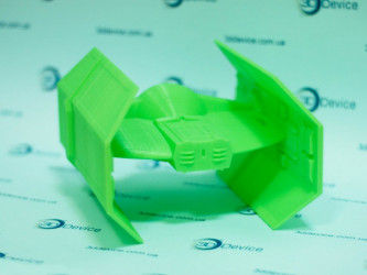 Green FDM 3D printed model of an Imperial TIE Interceptor from Star Wars. 3DDevice custom sci-fi model printing.