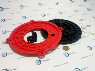 Red and black 3D printed complex modular structures (spools or covers) and small components. 3DDevice custom part manufacturing.