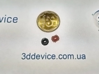 Micro 3D printed gears (black and red) next to a 50 kopeck coin. 3DDevice custom small component printing service.