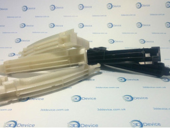 3D printed custom parts (light and black) for prototyping. 3DDevice professional manufacturing service.