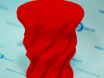 Red FDM 3D printed twisted decorative vase/pot. Custom home decor and modeling service by 3DDevice: 3ddevice.com.ua.
