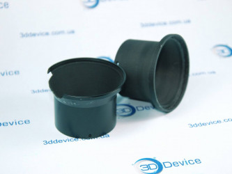 3D printed custom lens hood for a Nikon camera in black/gray plastic. 3DDevice custom accessory printing service.
