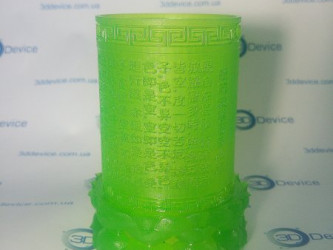 Green photopolymer SLA 3D printed vase with intricate patterns. High-detail decorative model service by 3DDevice.