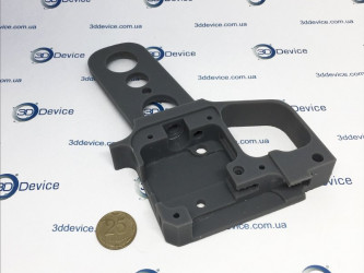 SLA 3D printed high-precision custom component/prototype (next to a ₴10 coin for scale). Detail-oriented resin printing service by 3DDevice: 3ddevice.com.ua.