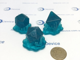 SLA 3D printed polyhedral dice/decorative elements from Transparent Blue Resin. High-resolution custom gaming accessory and modeling service by 3DDevice: 3ddevice.com.ua.
