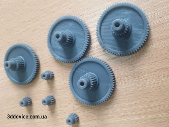 A set of SLA 3D-printed gears made with durable resin from 3DDevice.