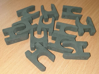 Batch of custom 3D printed SLS fasteners by 3DDevice for pipe mounting