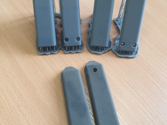 Gray 3D-printed SLA prototype parts with supports from 3DDevice.