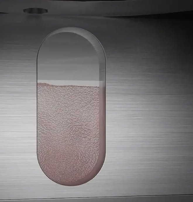 Модульная система картриджей DeskFab X1, демонстрирующая его многоматериальные возможности с различными металлическими порошками.